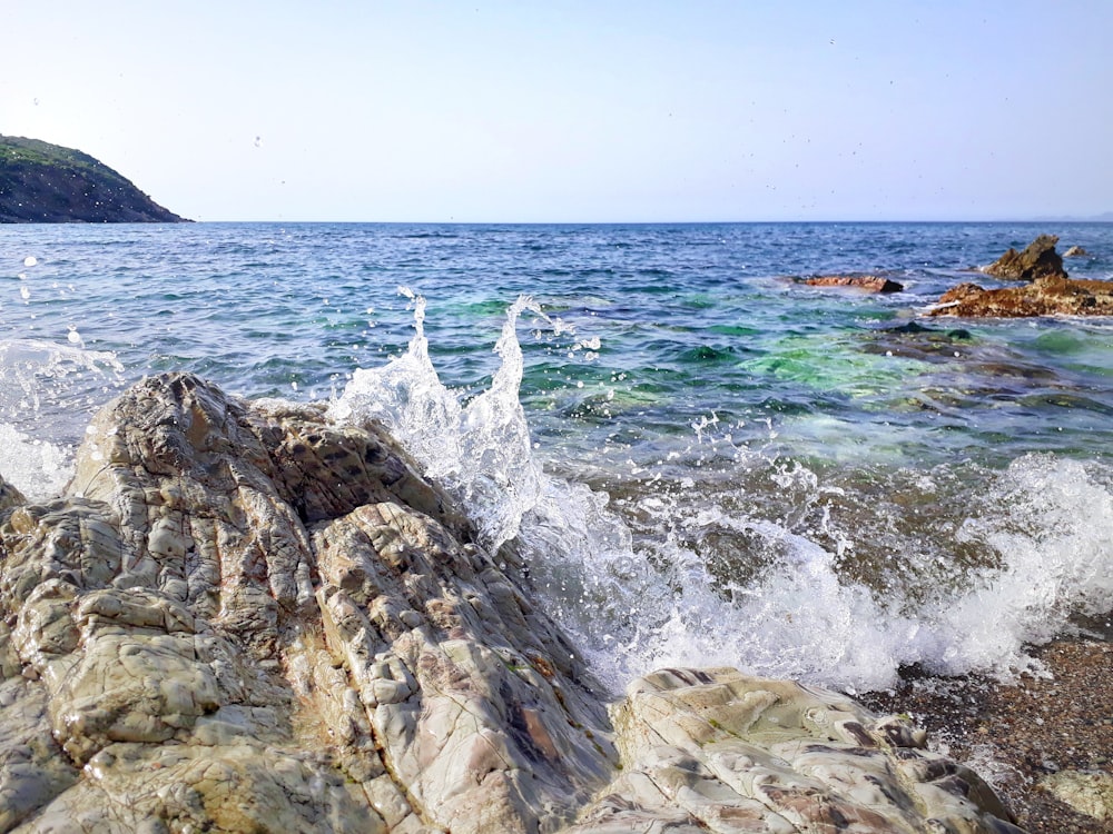 sea waves crushing on rocks