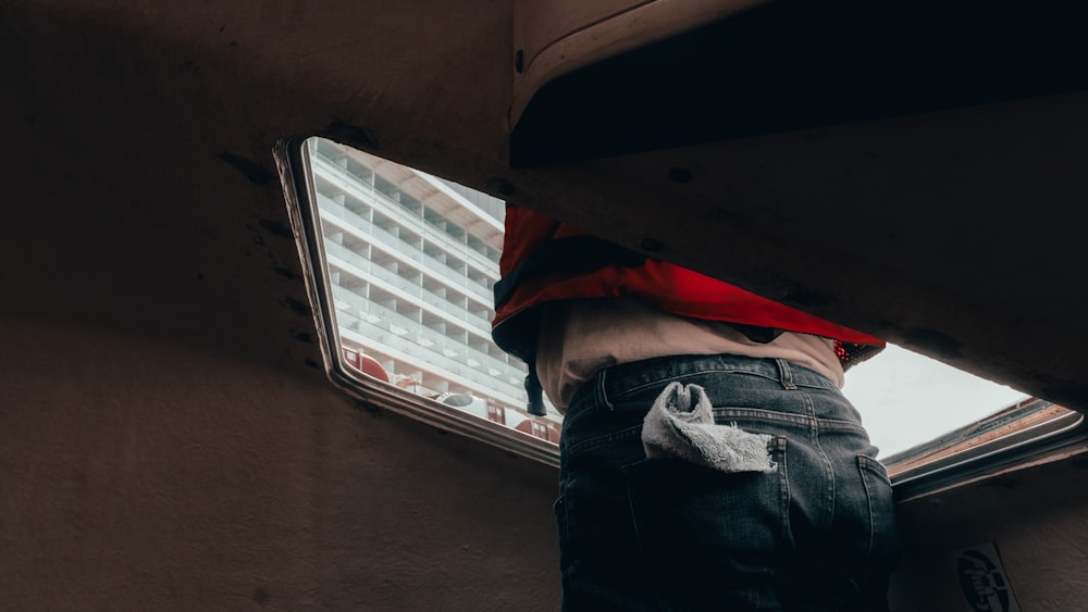 man in car roof visor