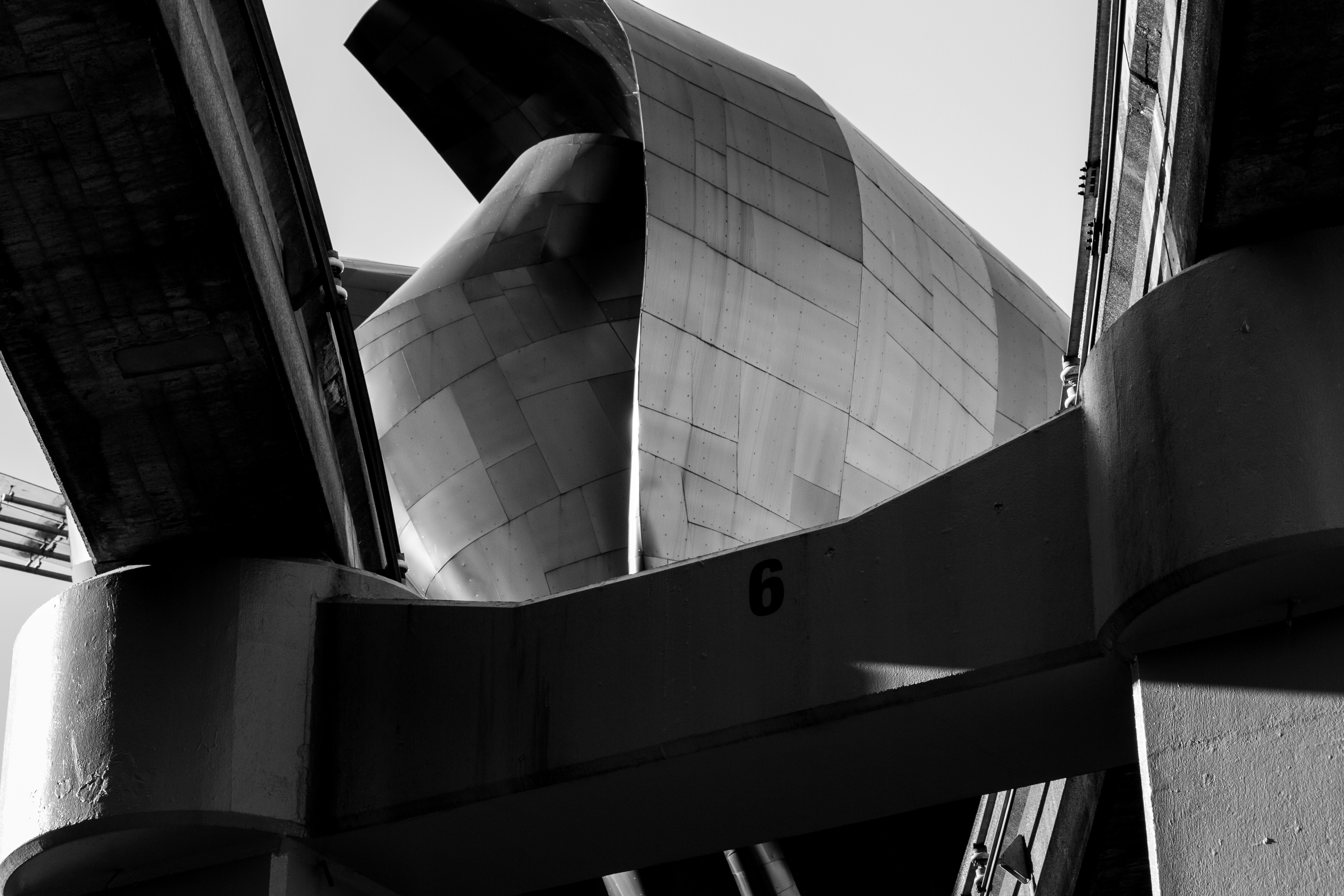 grayscale photography of glass building