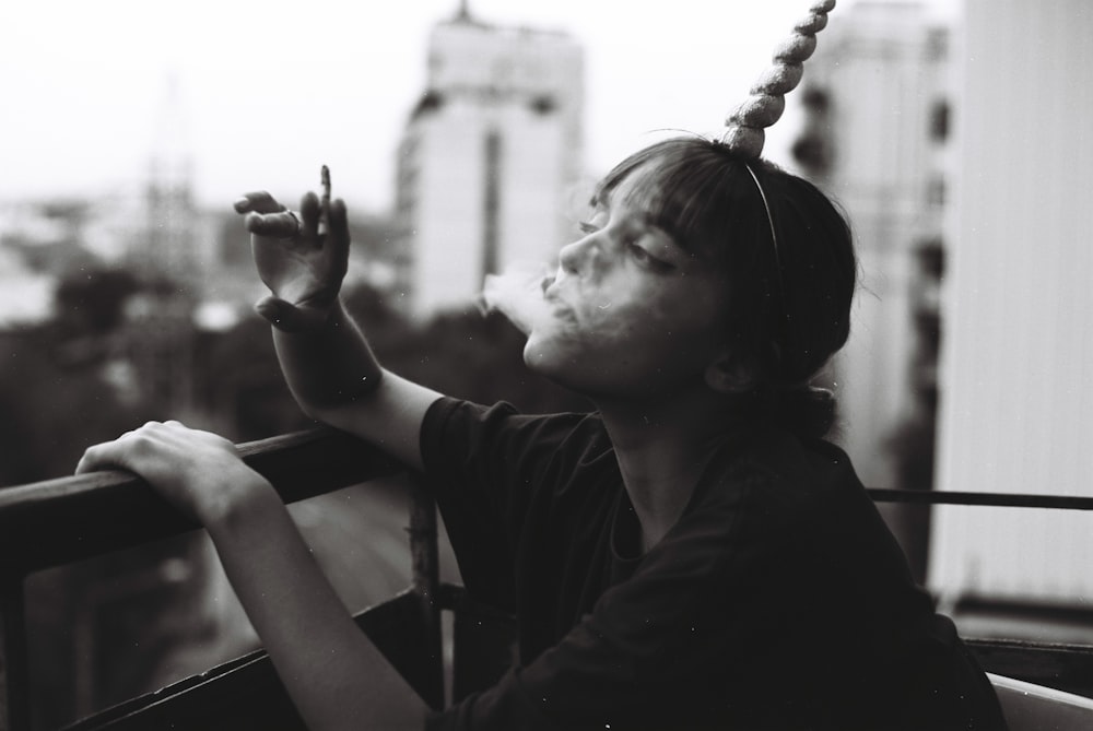 woman blowing off smoke