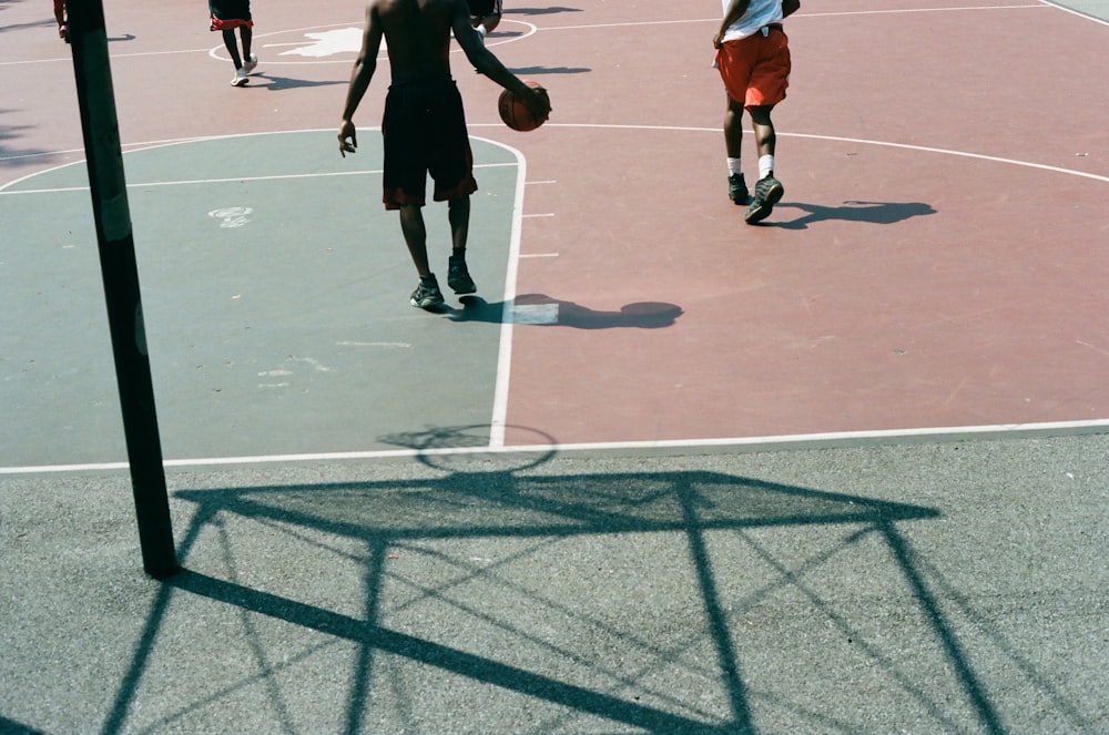 men playing basketball