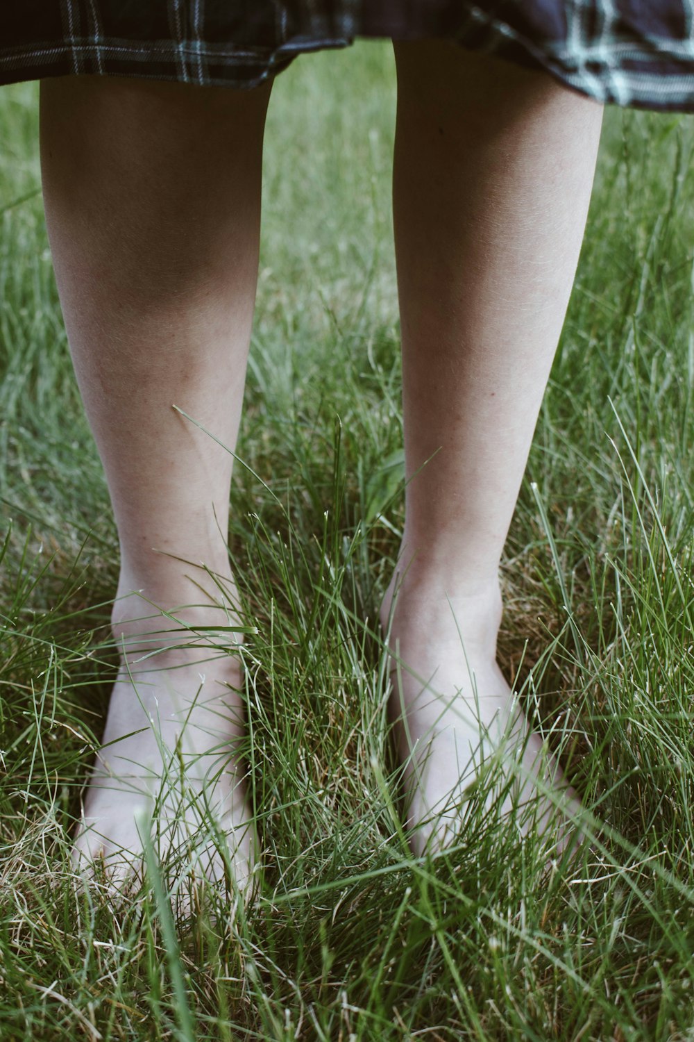 person standing on grass