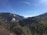 A scenic view of a Colombian landscape with mountains and a clear blue sky.