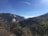 A scenic view of a Colombian landscape with mountains and a clear blue sky.