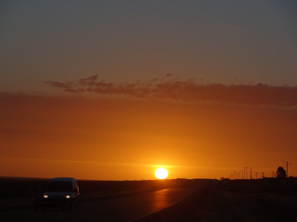 vehicle on road during golden hour