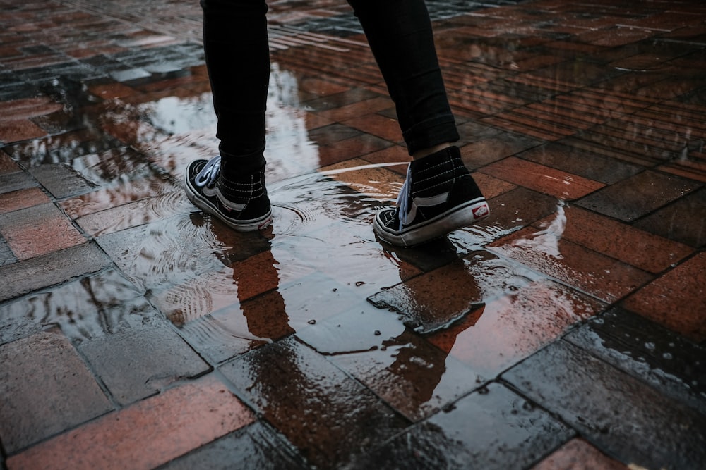 persons standing on wet floor