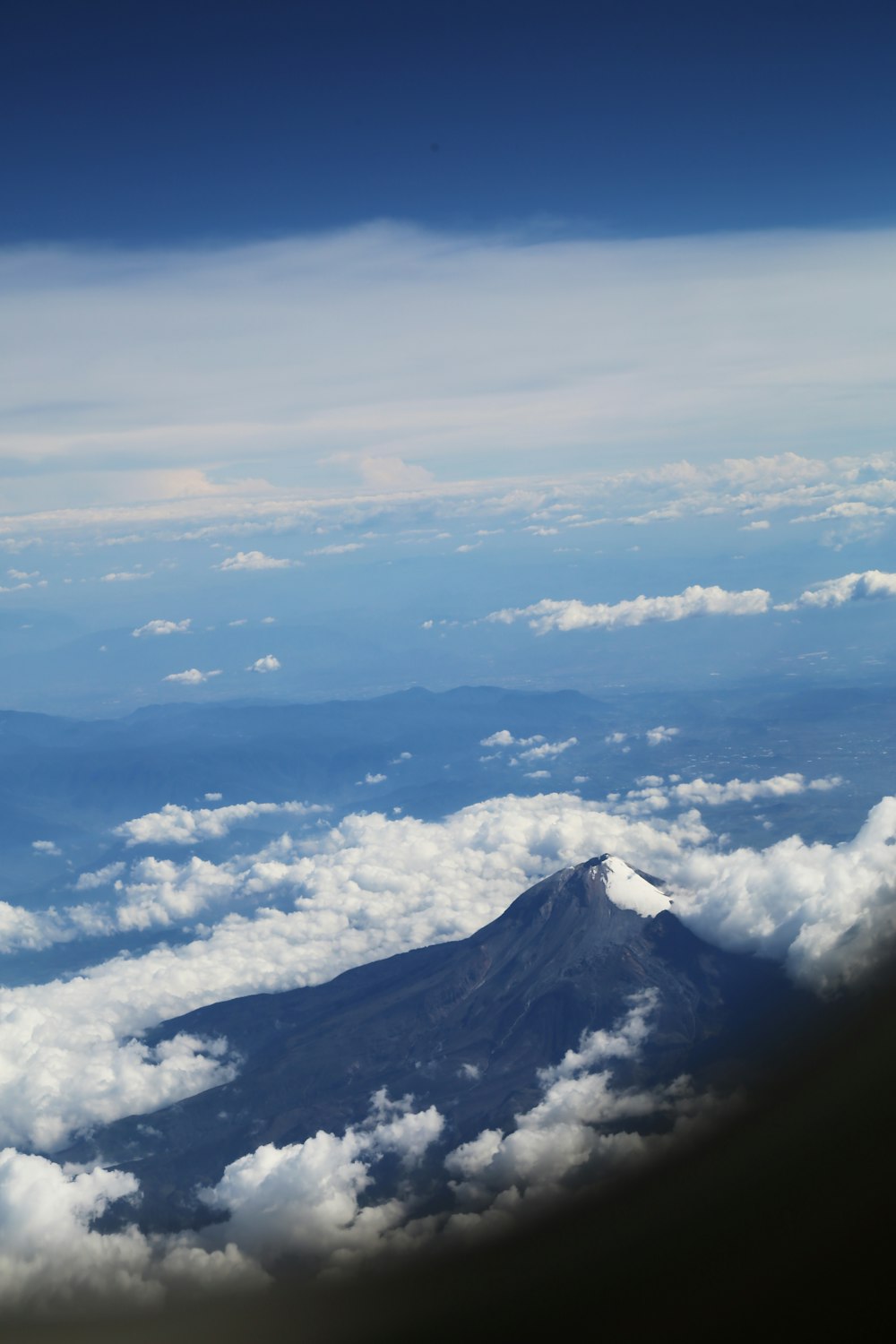 black mountains surrounded by clouds