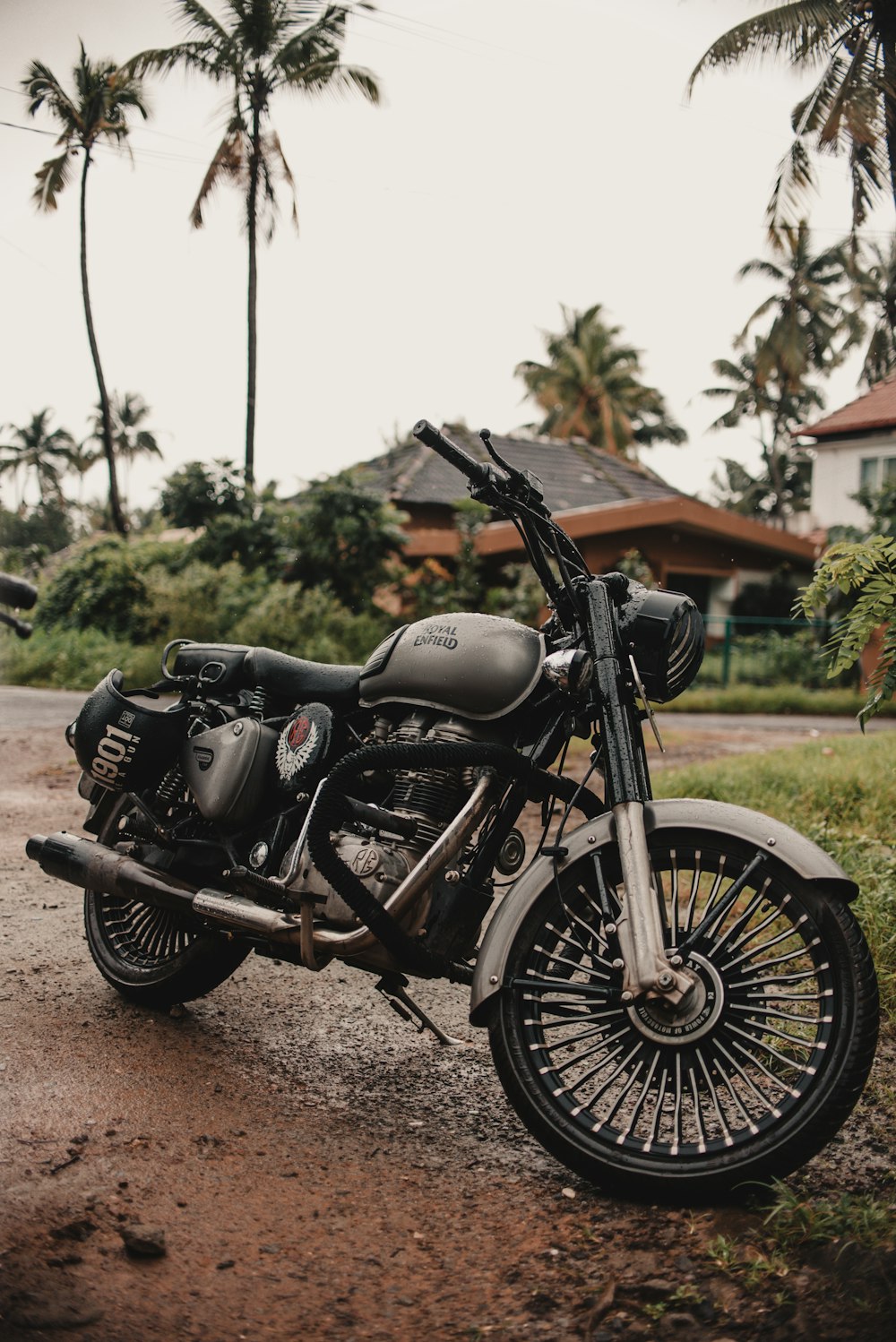 gray motorcycle parked outside house