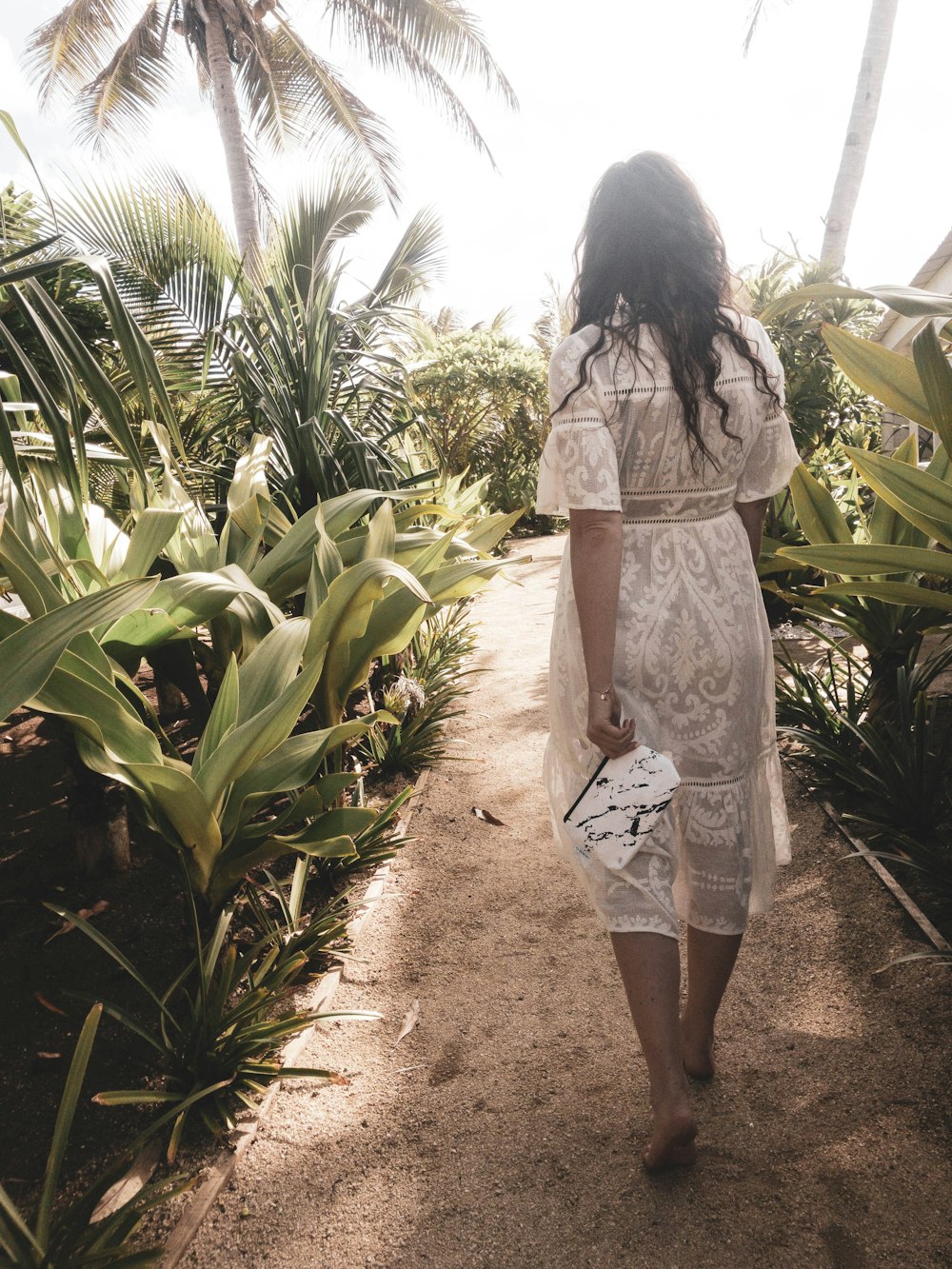 woman walking on corn field