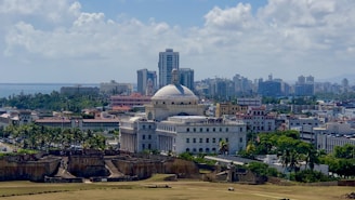 aerial photo of city buildings under cloudy sky