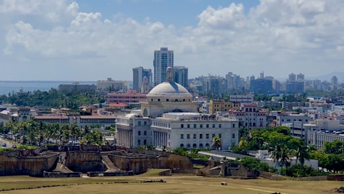 aerial photo of city buildings under cloudy sky
