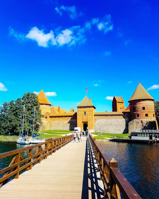 brown wooden bridge in Trakai Island Castle Lithuania