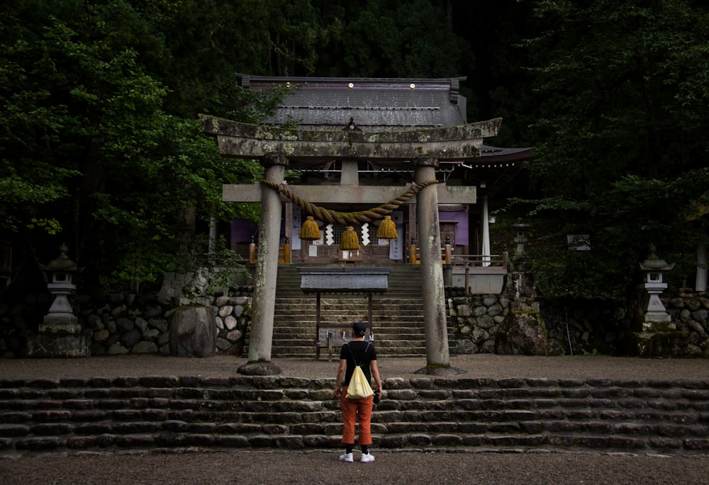 man standing near temple