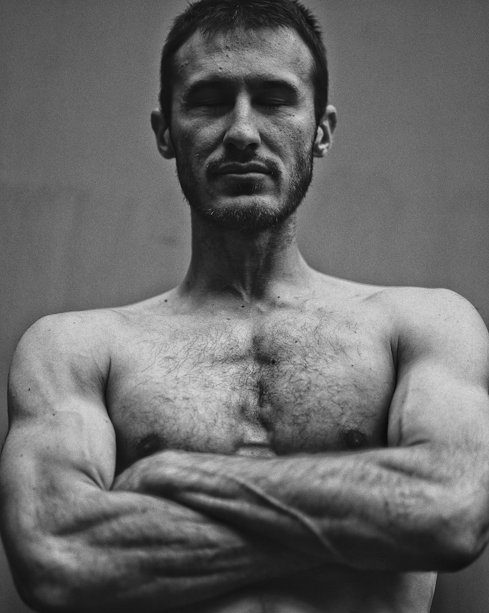 grayscale photo of topless man