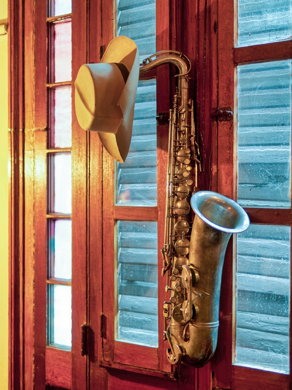 brown wind instrument mounted on wall