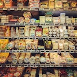 Assortment of dairy products including butter, milk cartons, and cheese wedges.