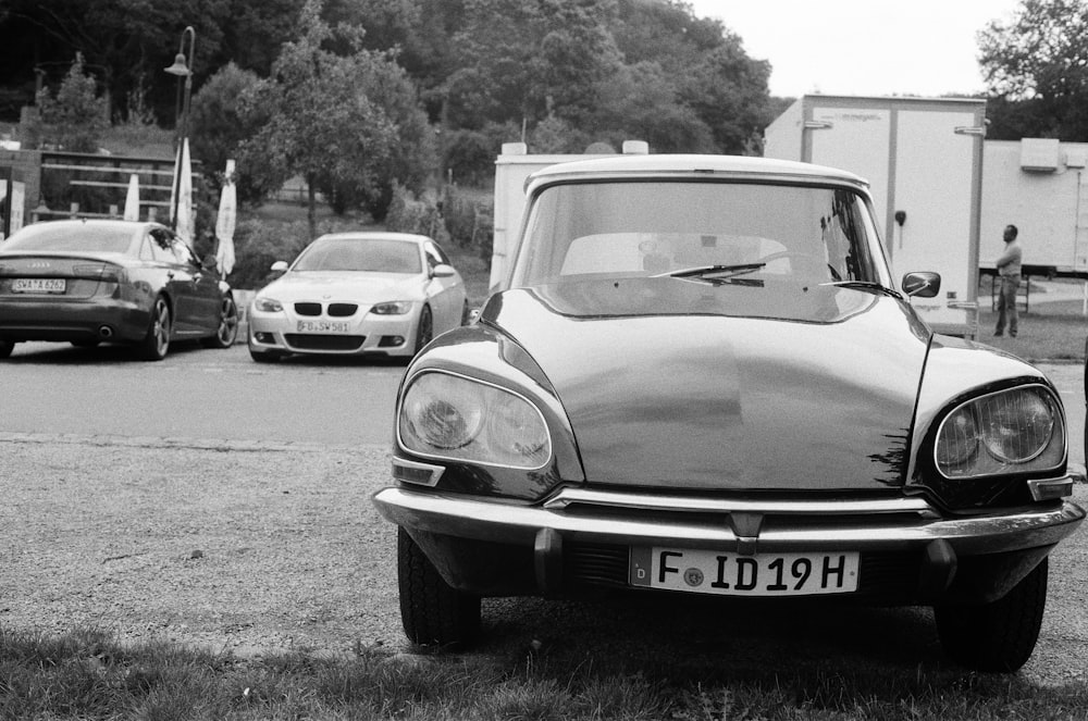 grayscale photo of classic vehicle