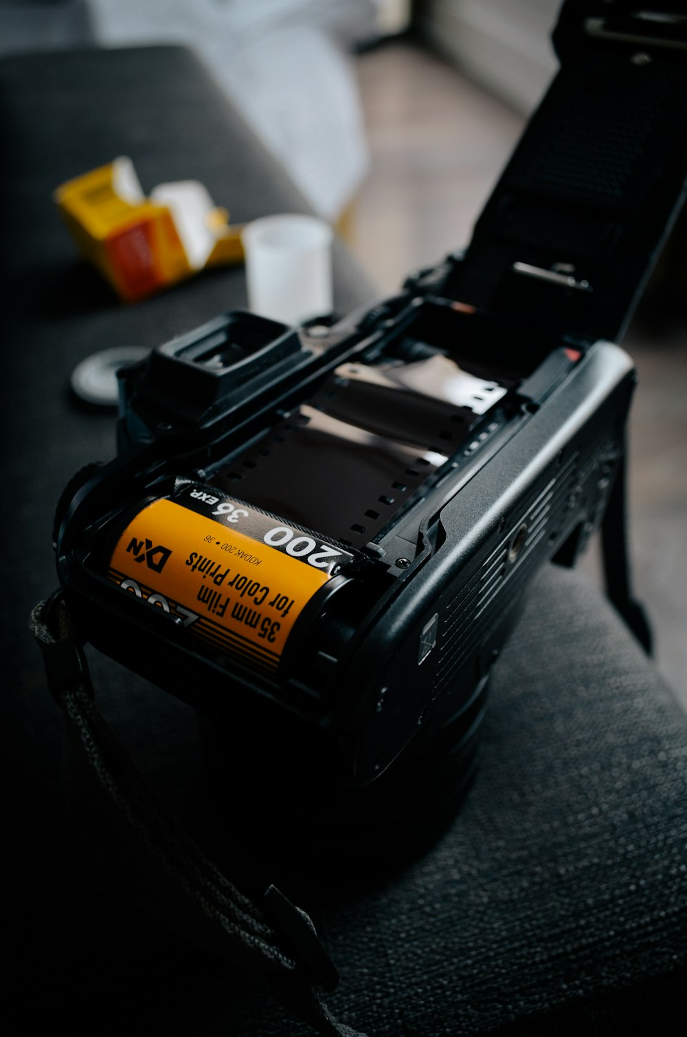 black camera with yellow and black battery