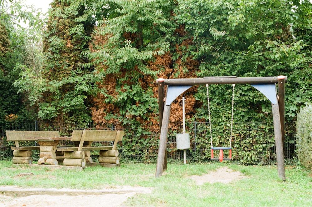blue and brown playground swing