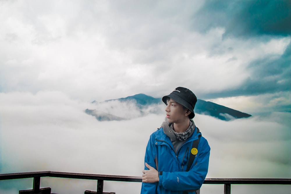 man standing near handrail