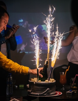 man holding liquor bottle in bucket