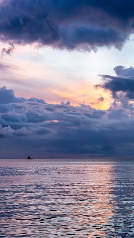 body of water and cloud