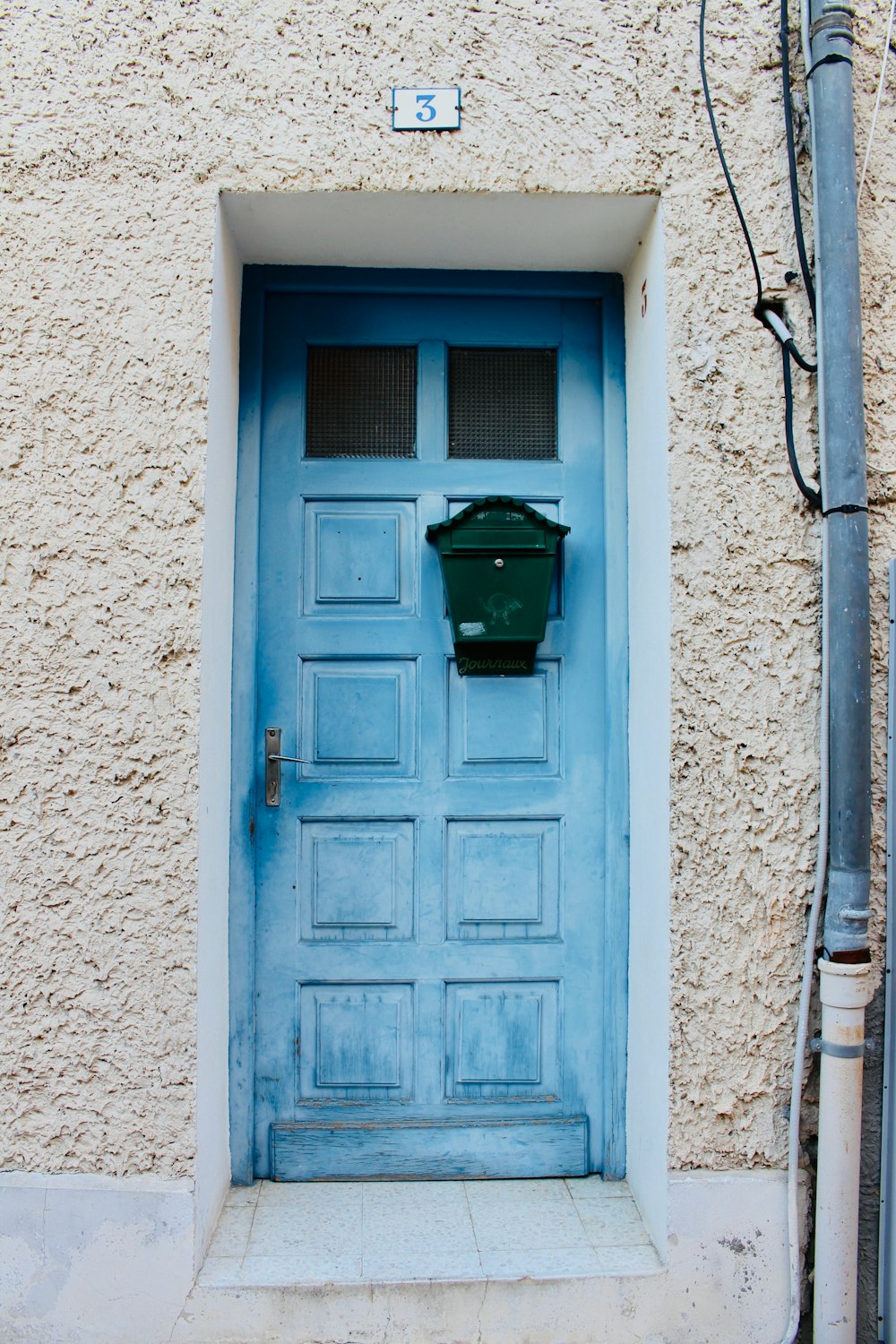 teal wooden door