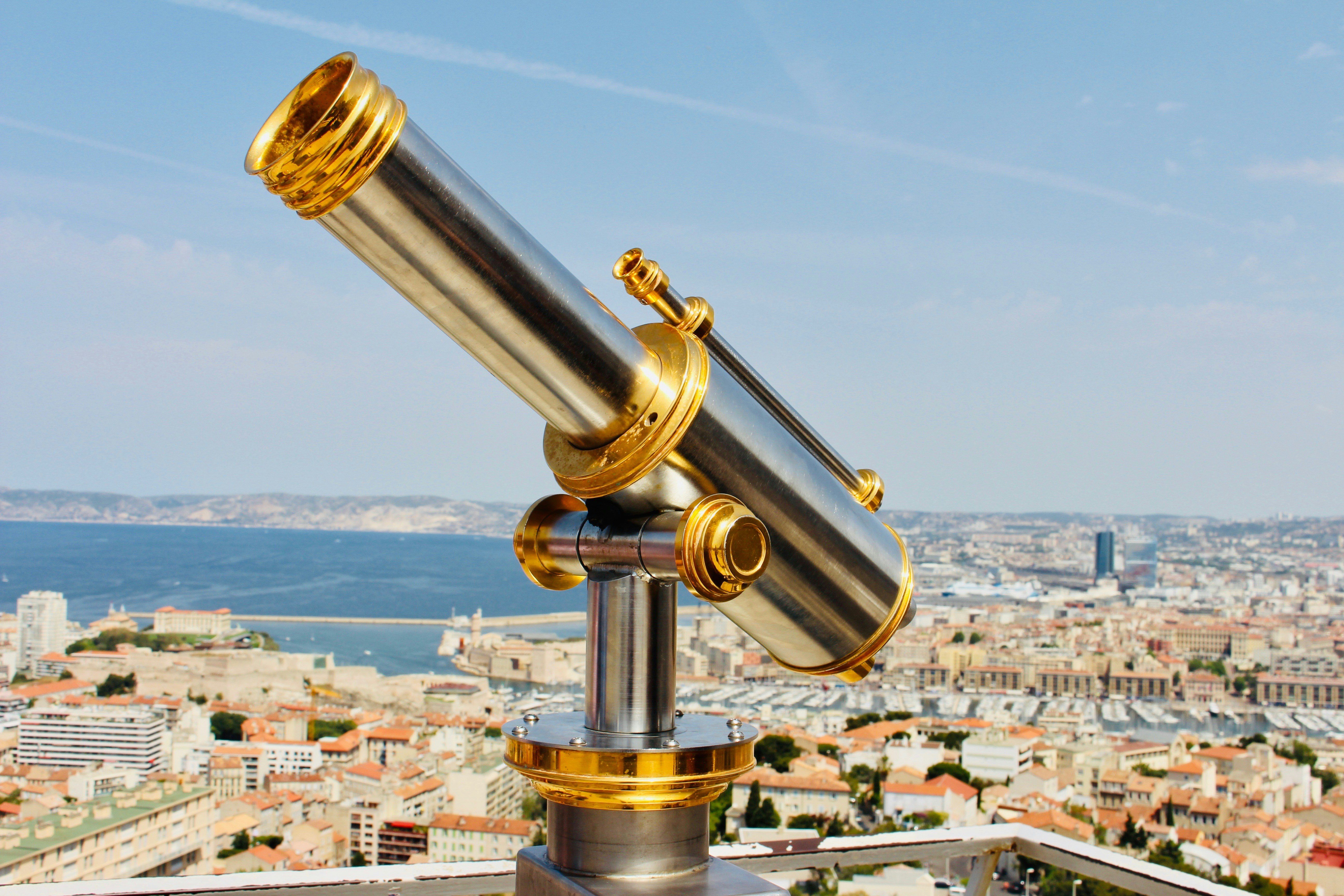gray and gold-colored telescope at daytime, Golden view.