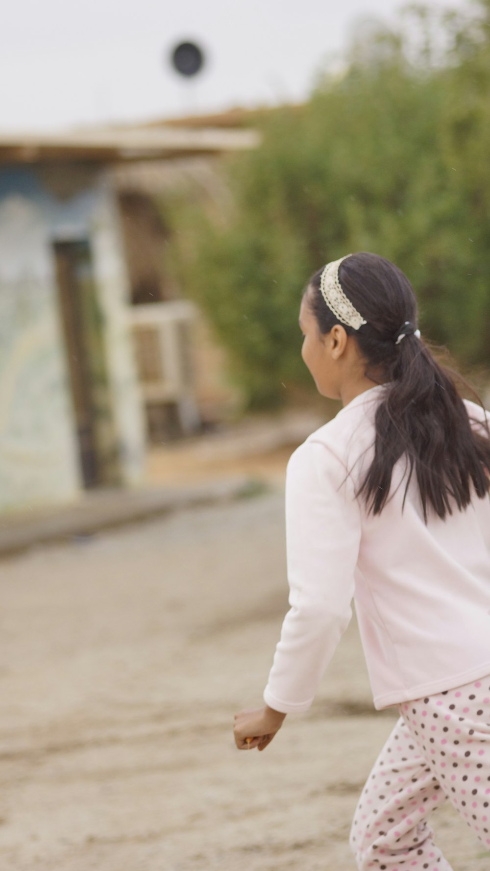 girl running near tree