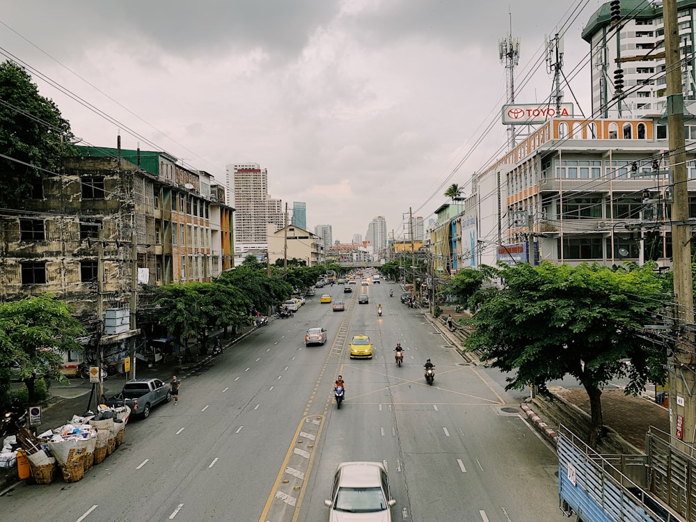 cars and motorcycle on road