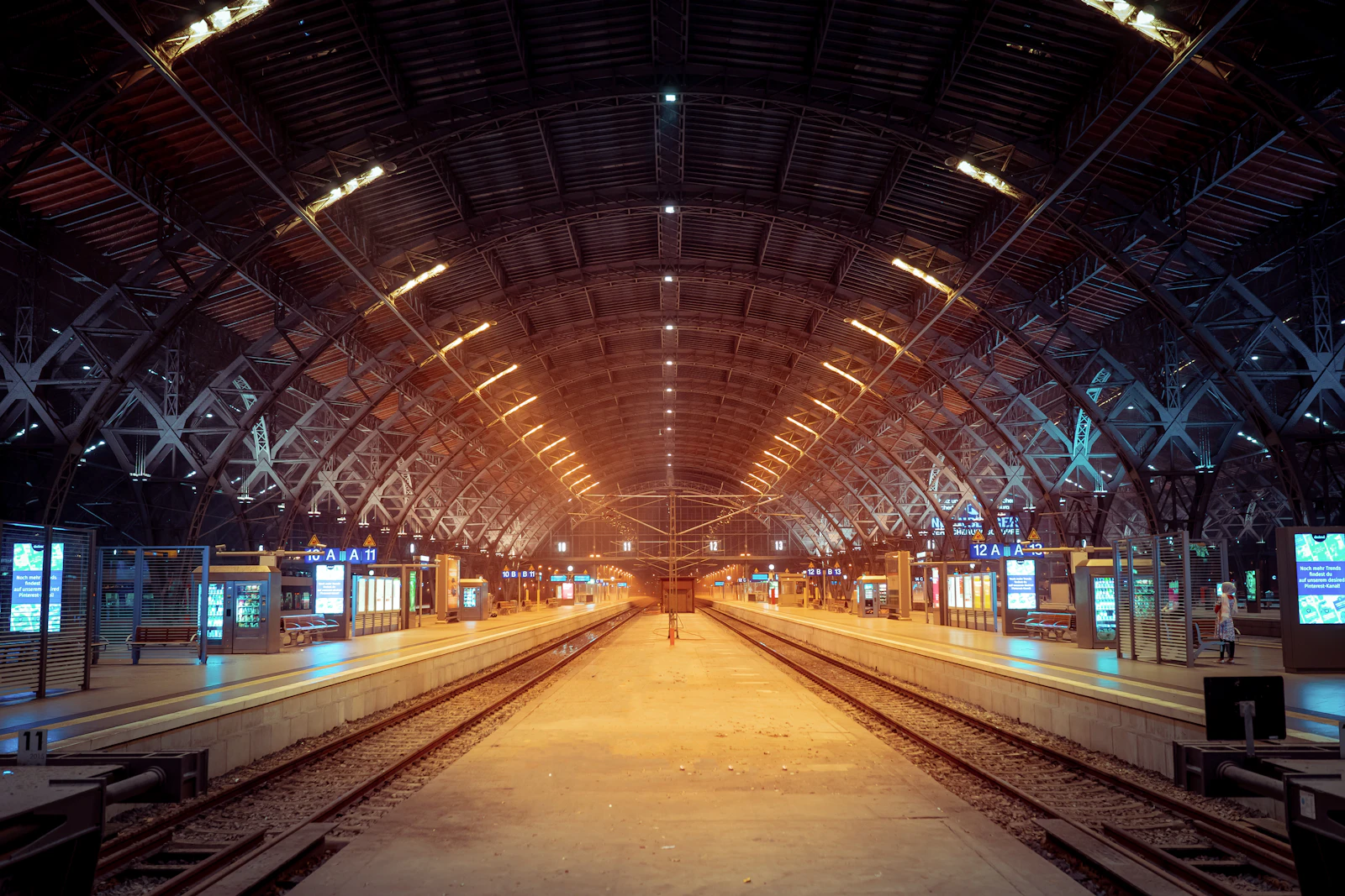 Passengers walking through a large European railway station