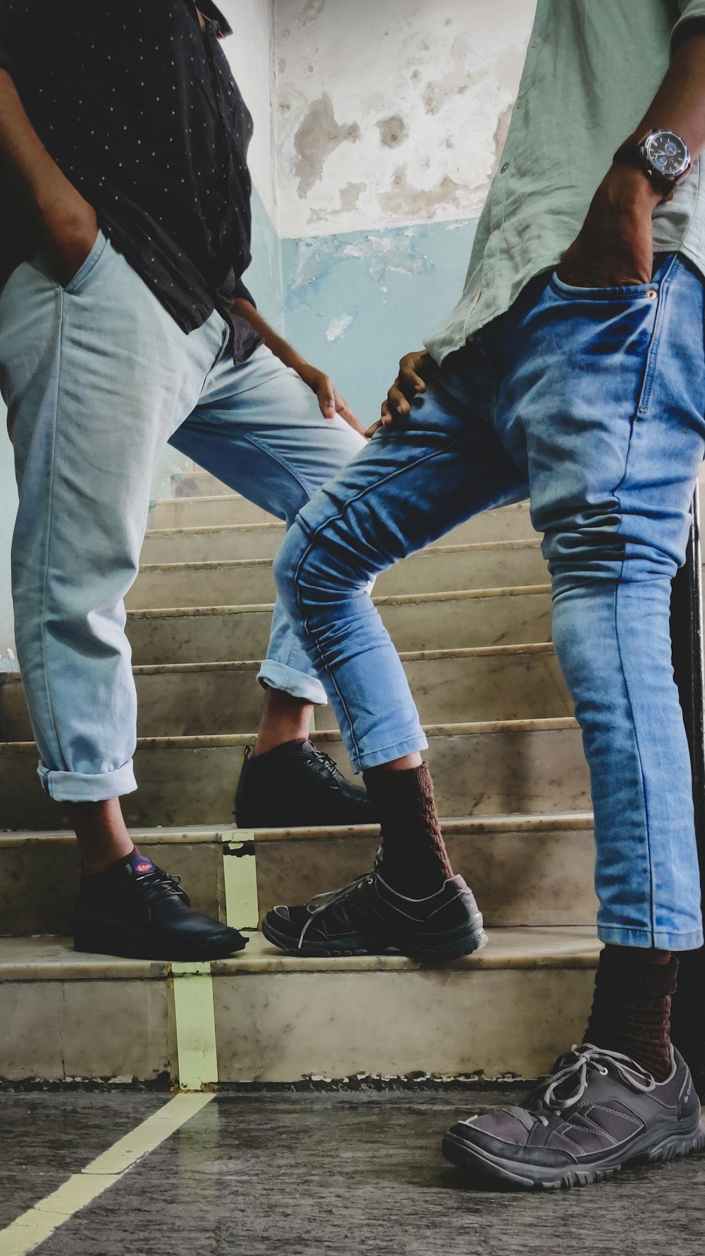 two men standing on stairs