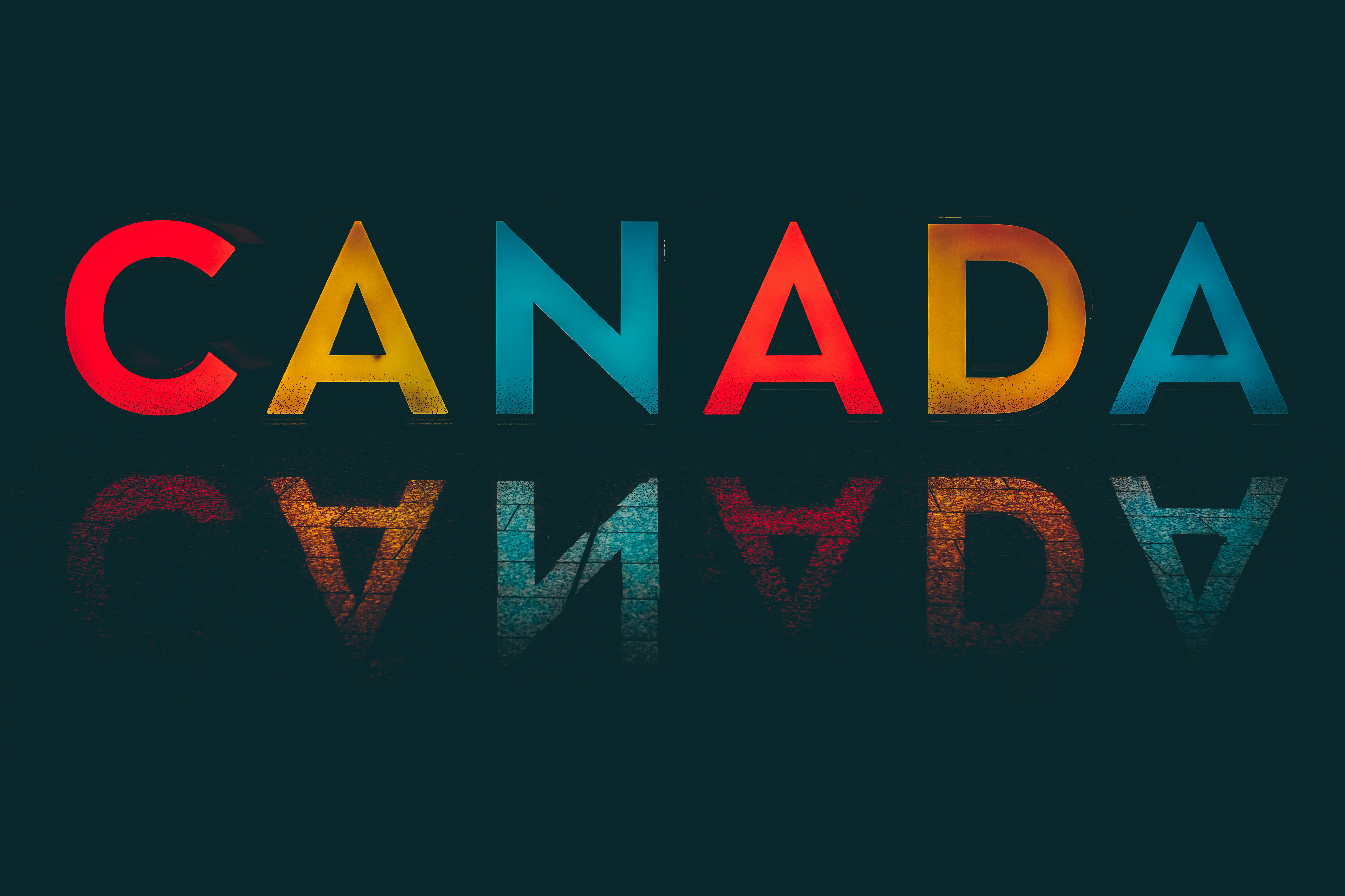 When you land in Calgary Airport (YYC) and get through security, you can find this massive Canada sign reflecting onto the floor below. It's a bit flat on its own so I've really brought out the colours of the sign against a load of dark shadows.