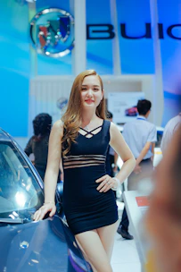 A confident woman entrepreneur presenting her brand at a networking event.