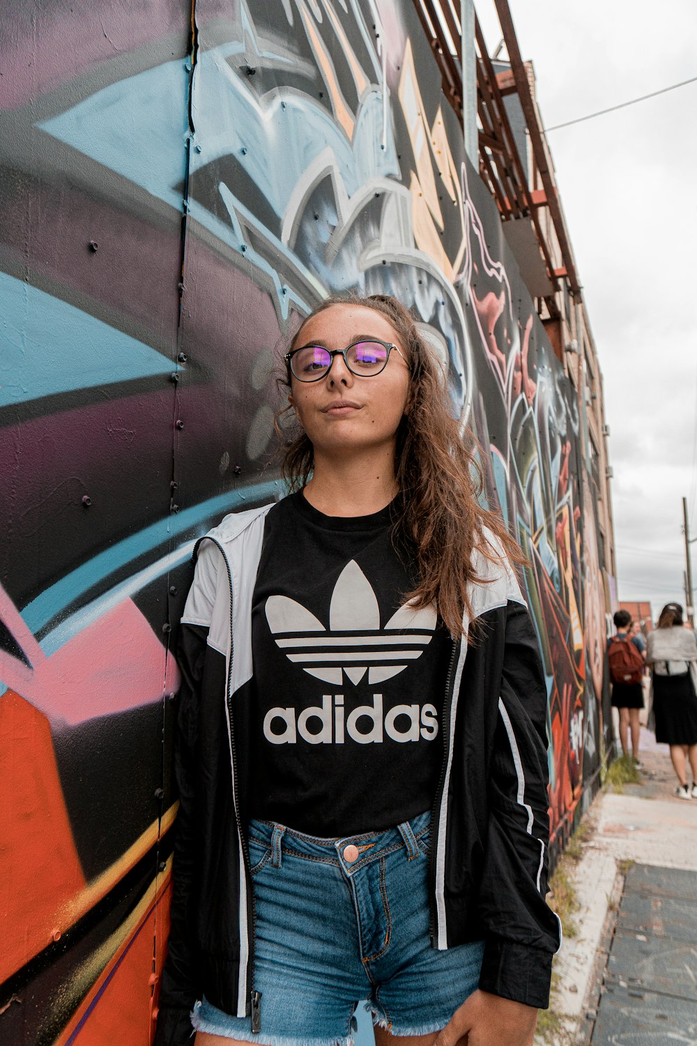 woman wears black frame eyeglasses