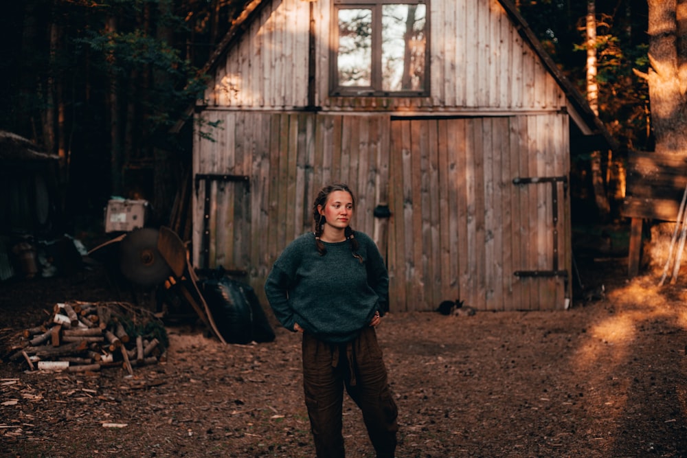 woman near brown house