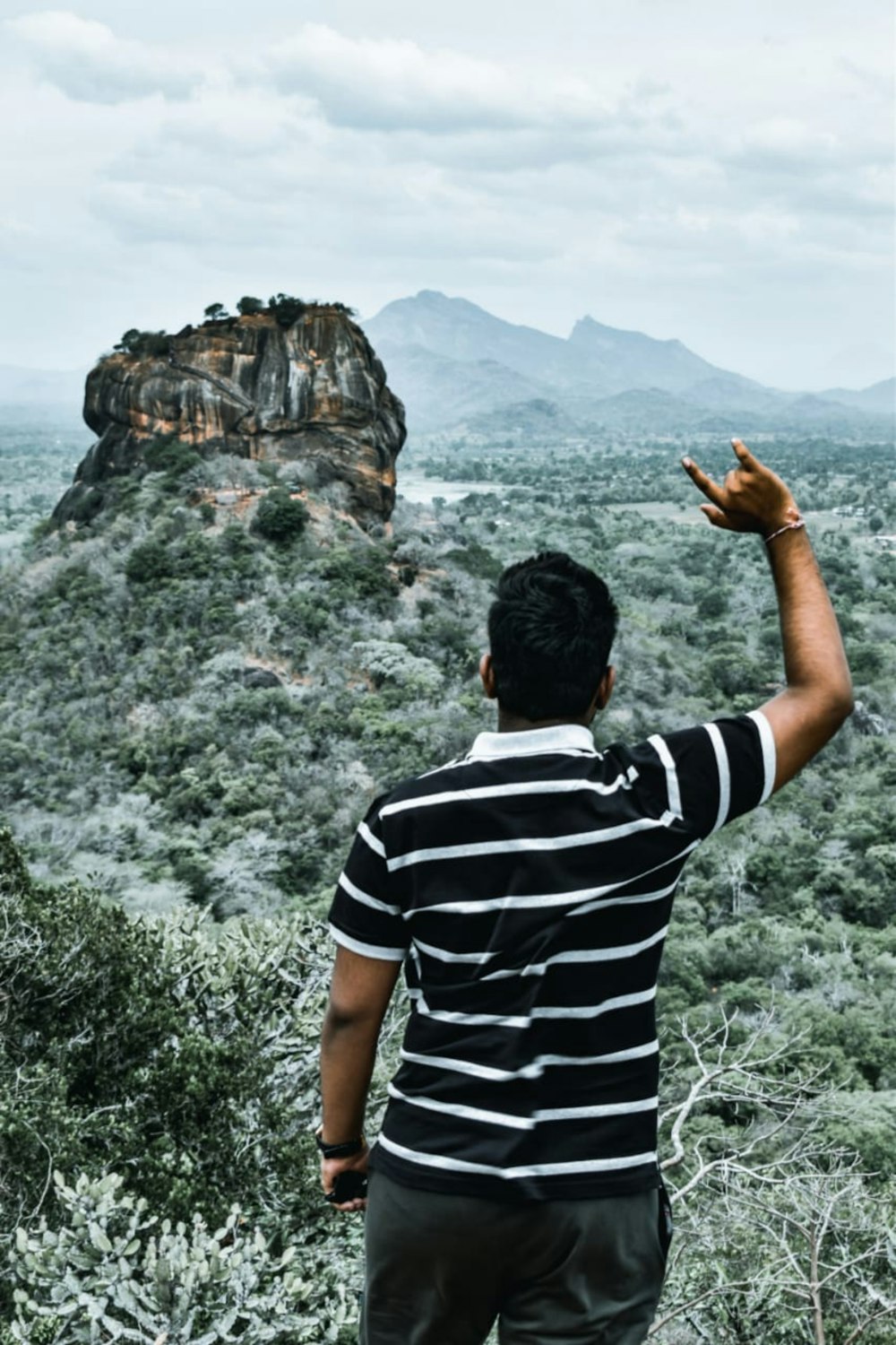 man standing on hill