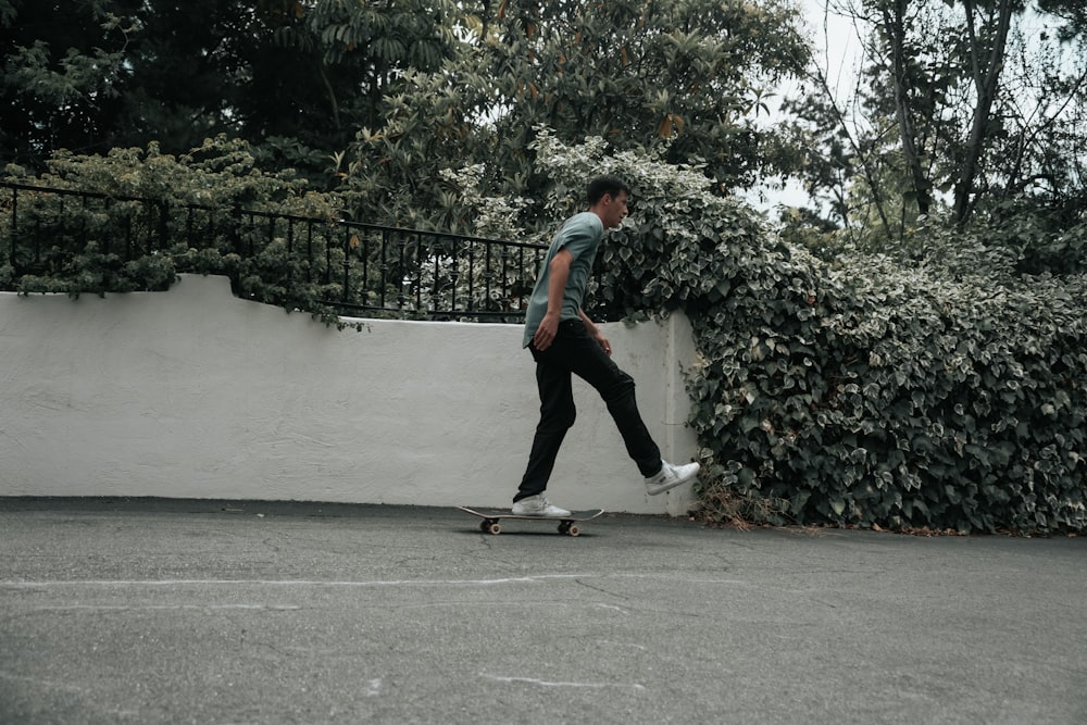 a man riding a skateboard down a street