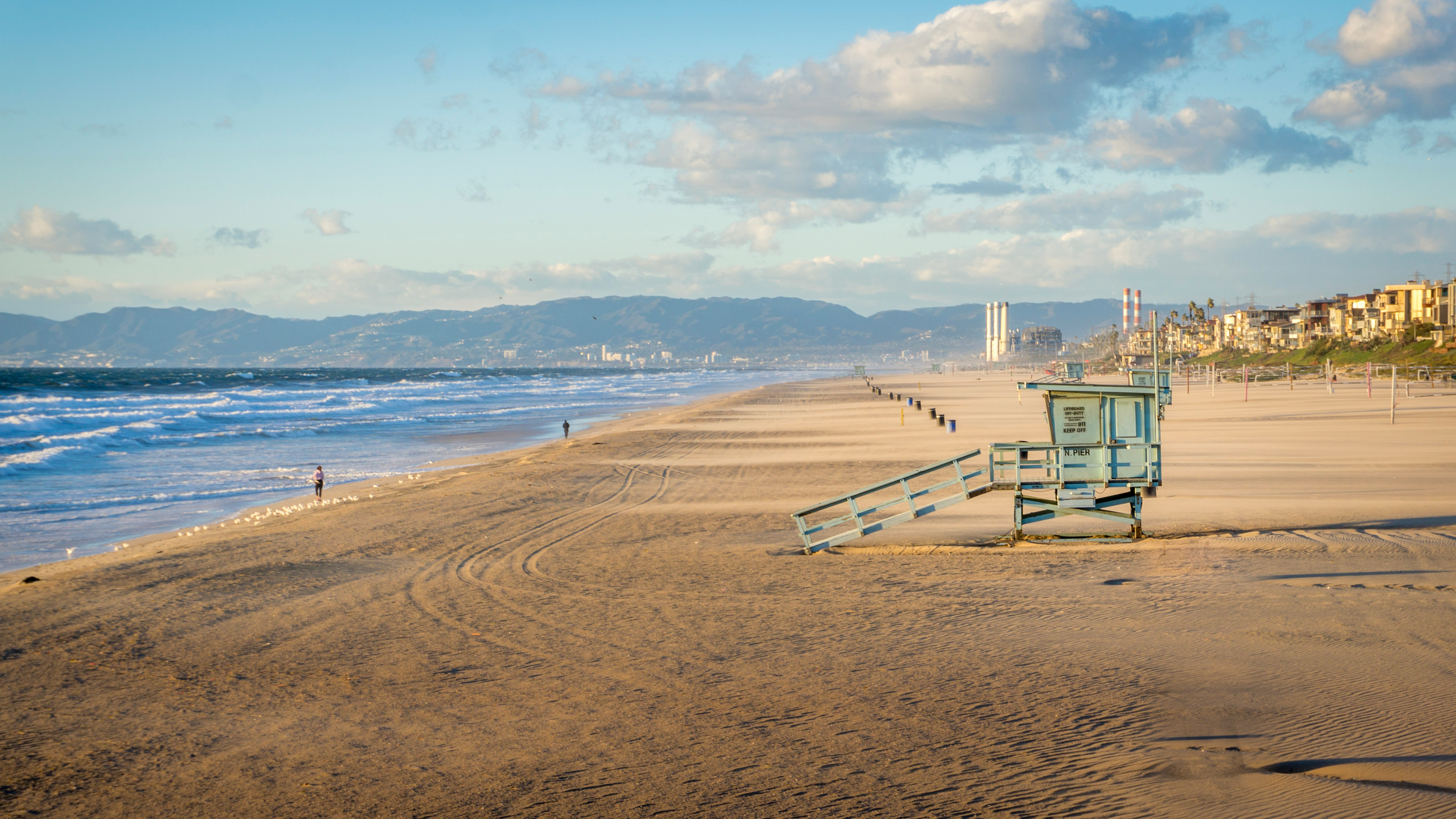 blue wooden watch tower on shore