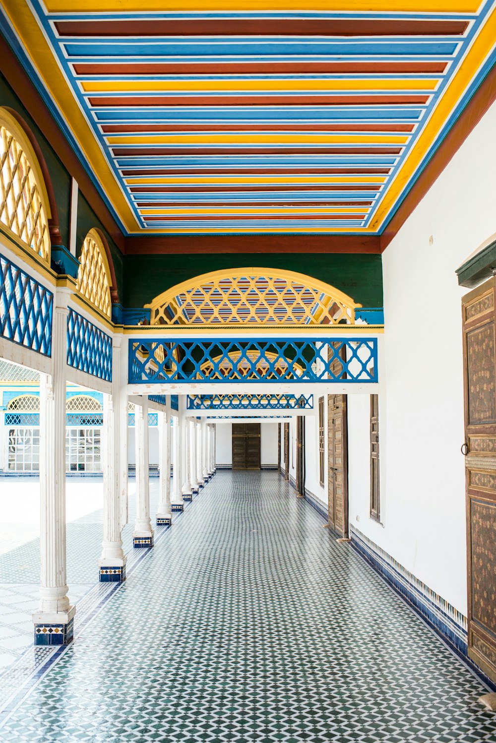 hallway with closed doors and posts