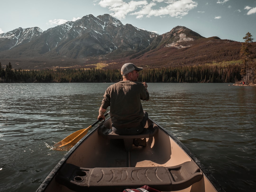 man rides boat