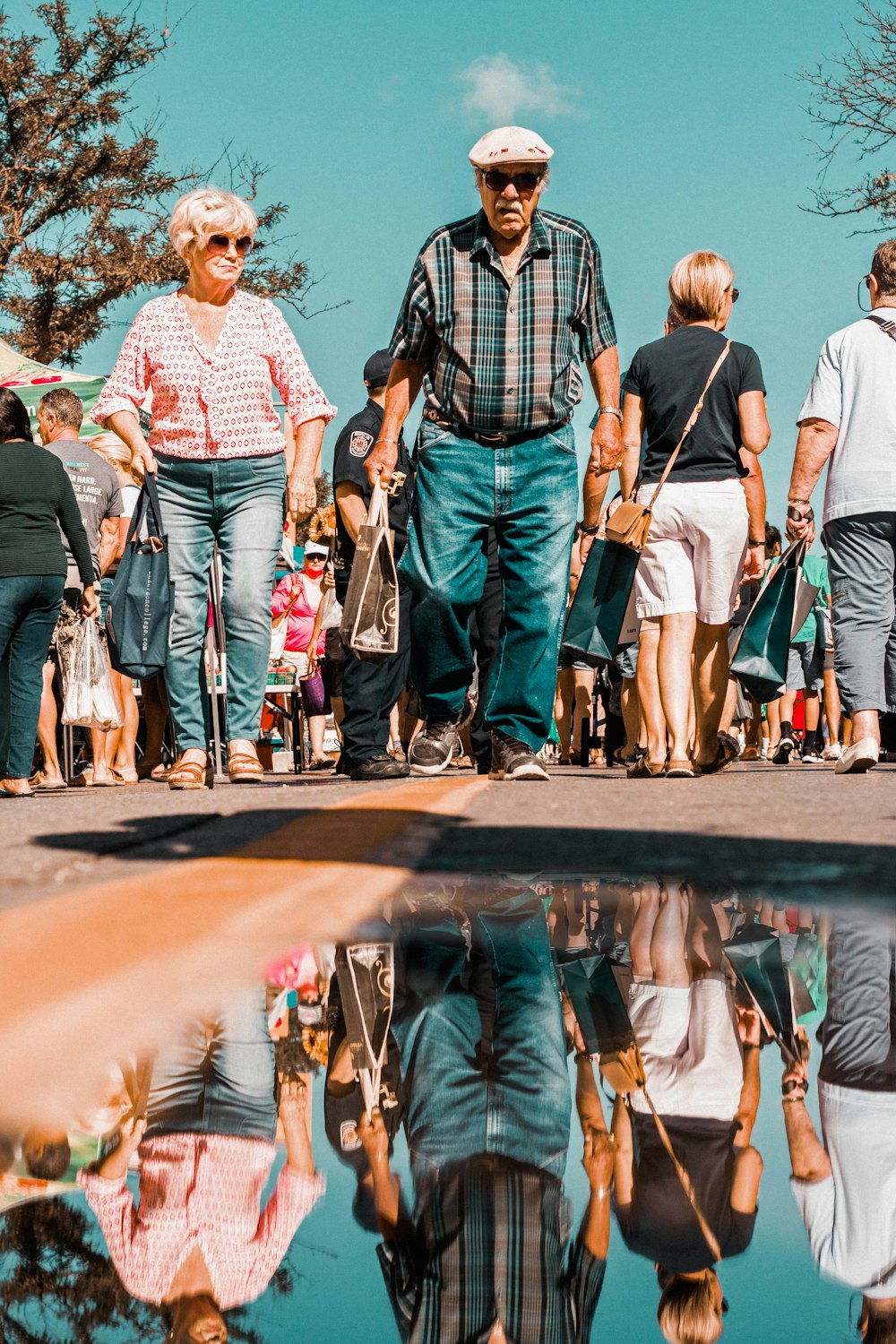 people walking near water puddle