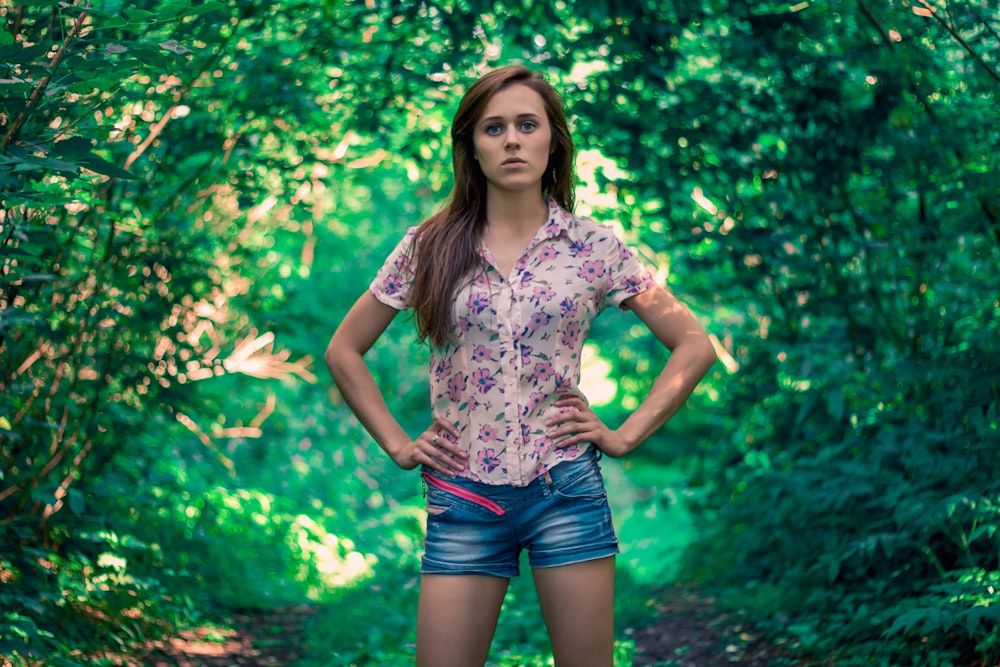 close-up photography of woman standing near plant