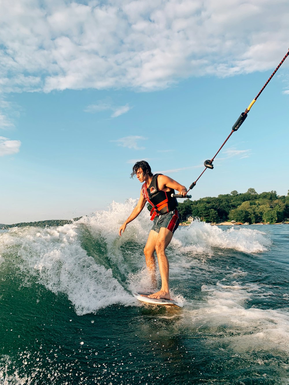 man wakeboarding on sea