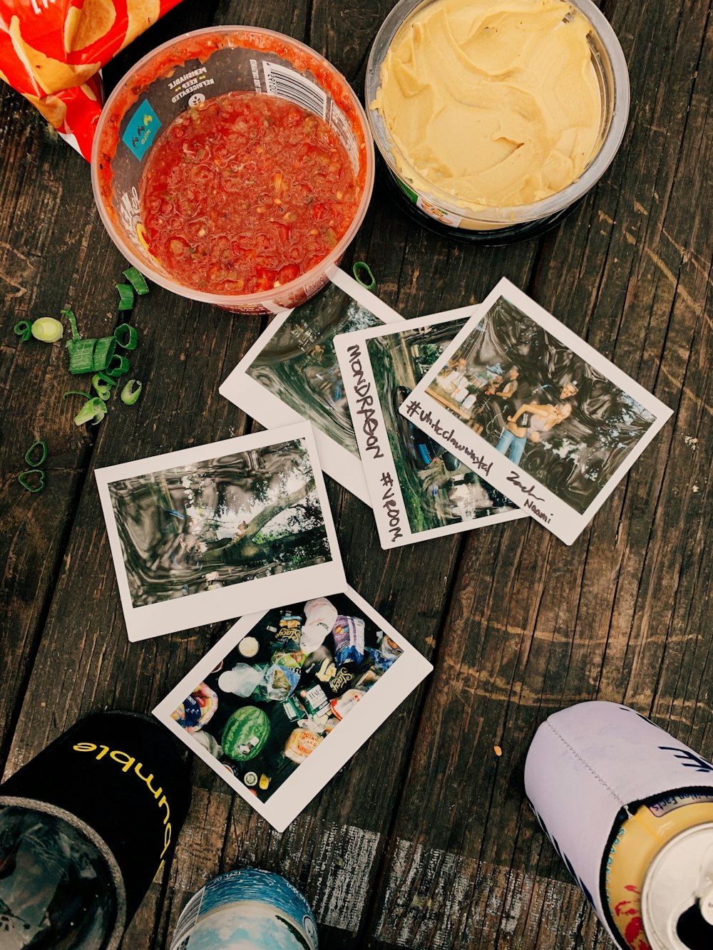 photos and bottles on table