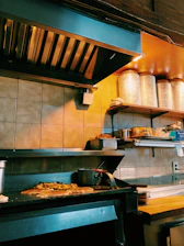 A busy commercial kitchen receiving a fresh delivery of bulk food supplies