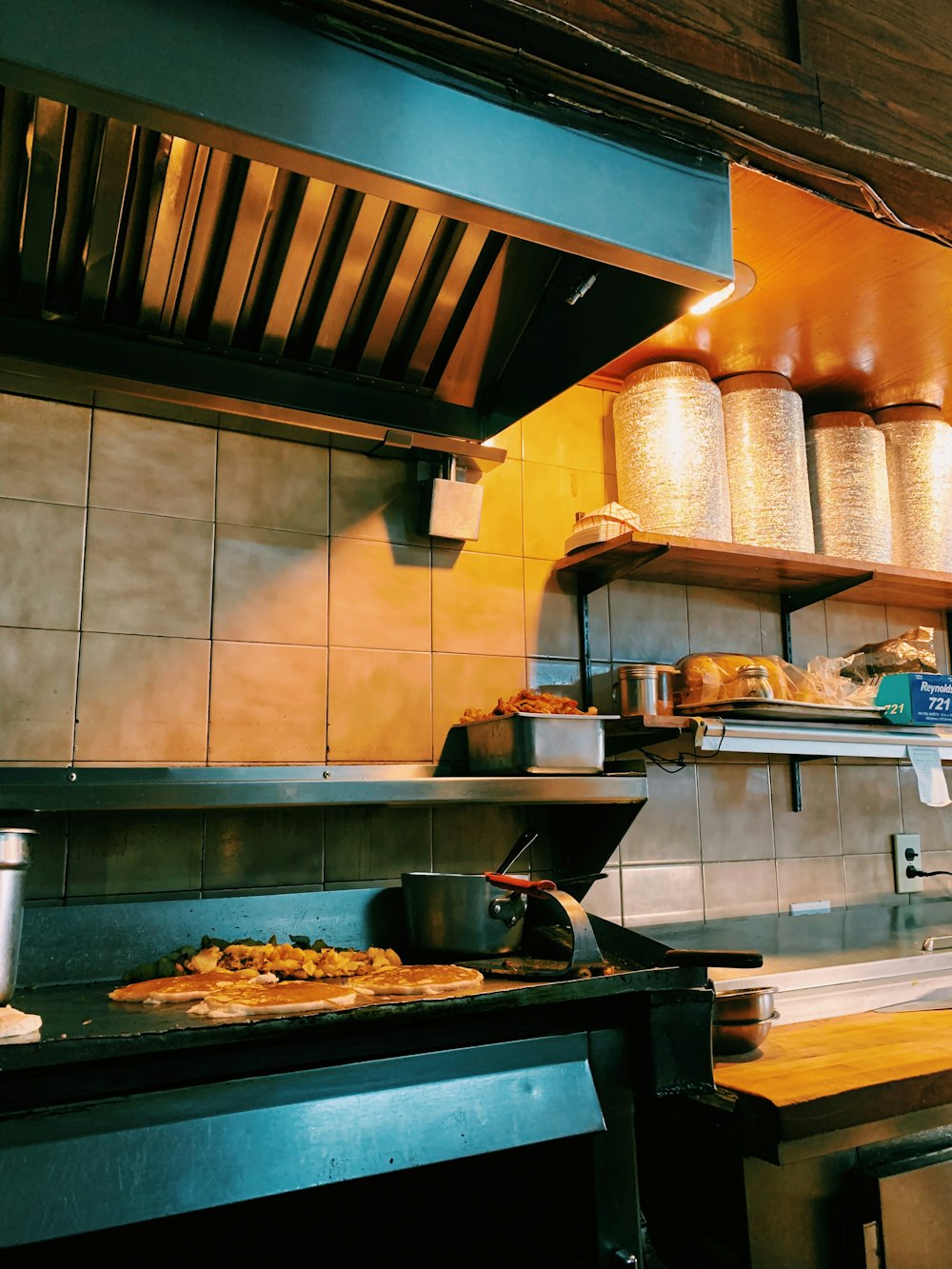 grilled food on griddle at kitchen area