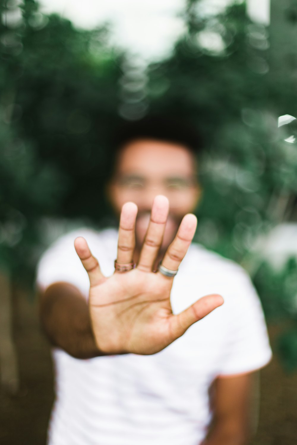 man standing and showing right hand