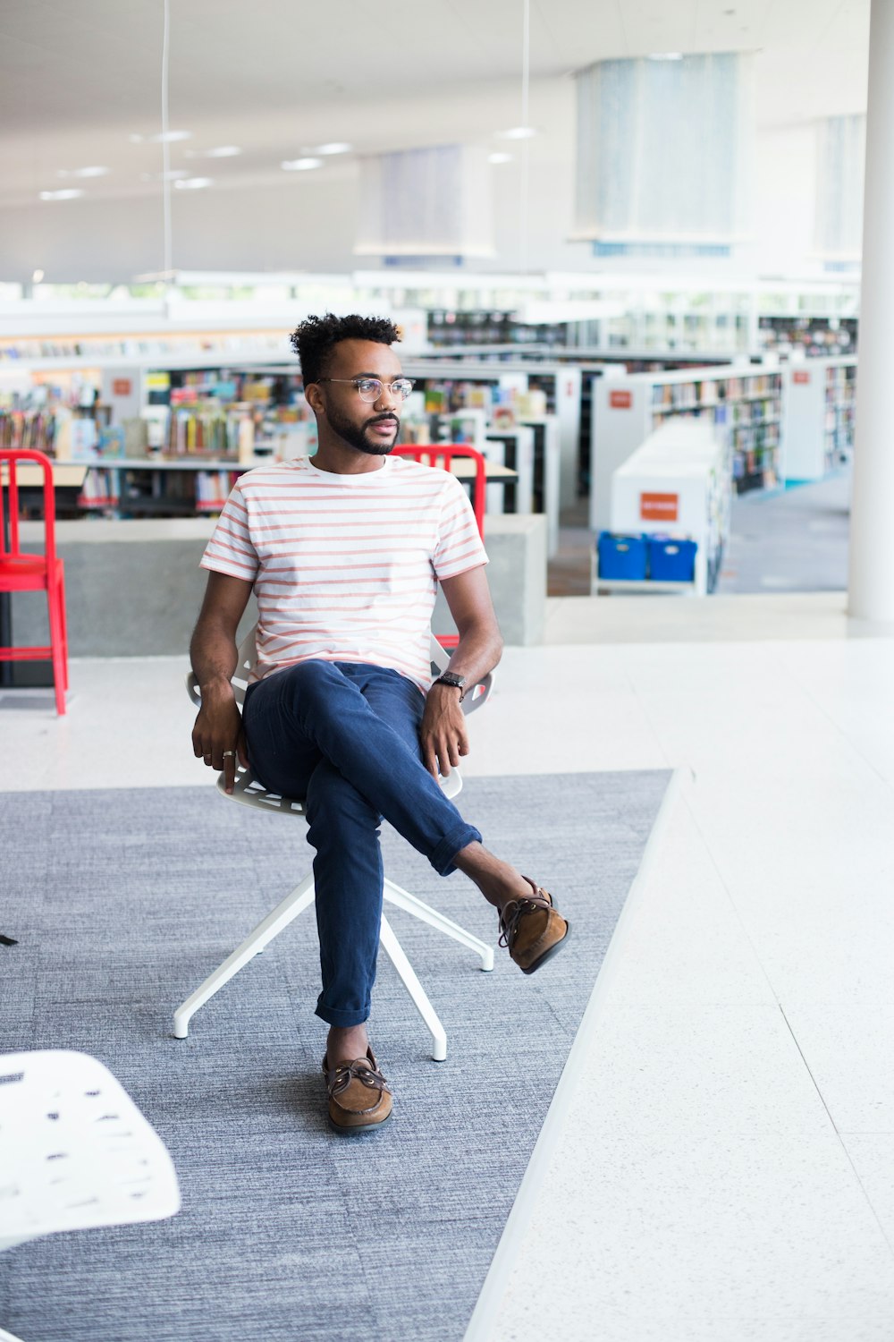 man sitting on chair inside building