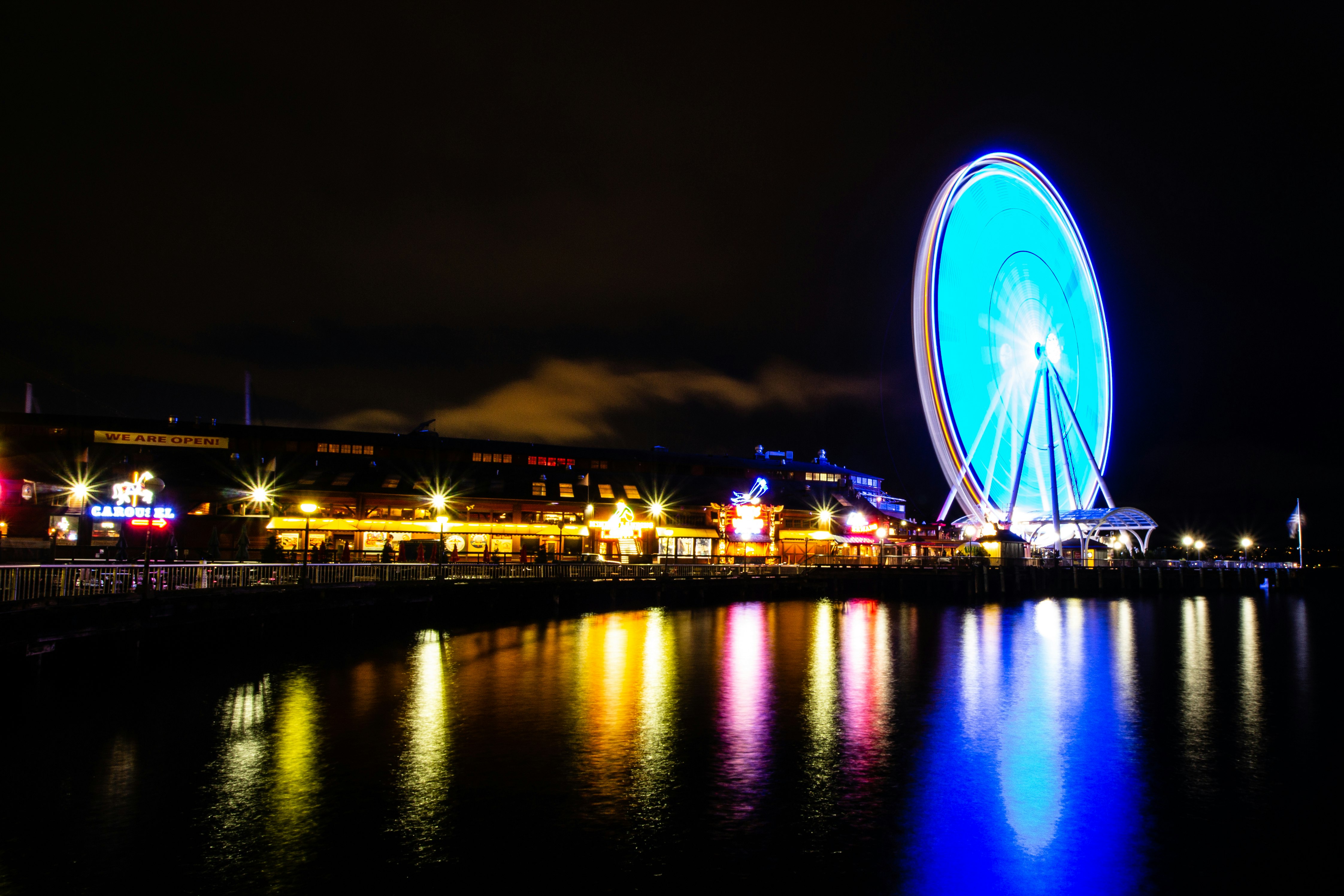 Ferris wheel and buildings during night